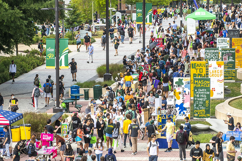 Large crowd of students gather on Wilkins plaza to attend the annual "Get Connected" campus activity fair. 