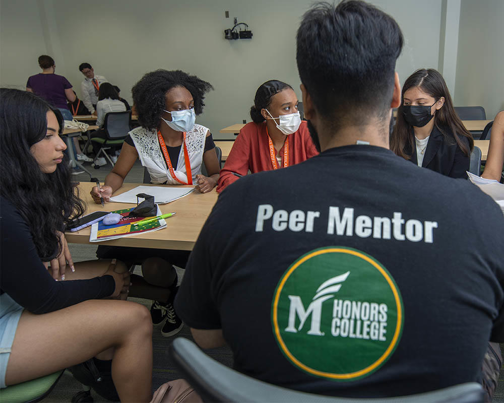 GMU honors college peer mentor tutors high school students for the Early Identification Program (EIP) 